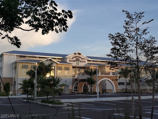 view of outdoor building at dusk