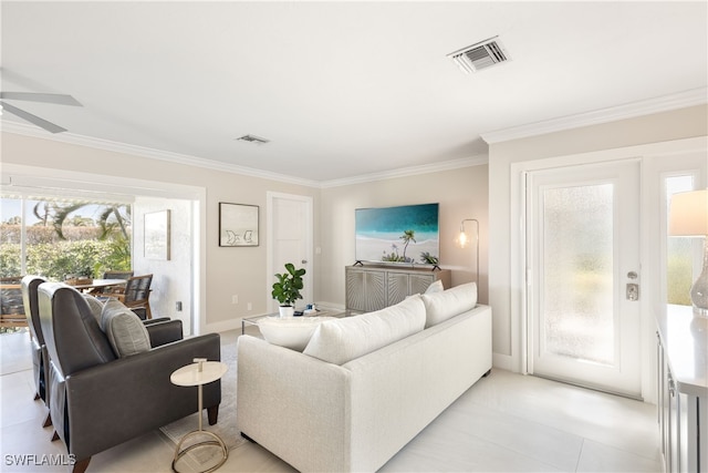 living room featuring ceiling fan, light tile patterned floors, and ornamental molding