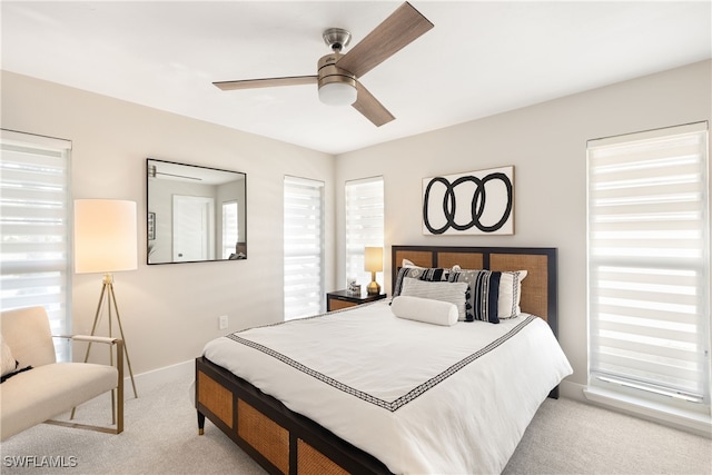 bedroom with light carpet and ceiling fan