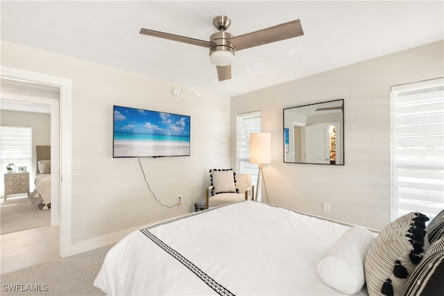 bedroom with light colored carpet and ceiling fan