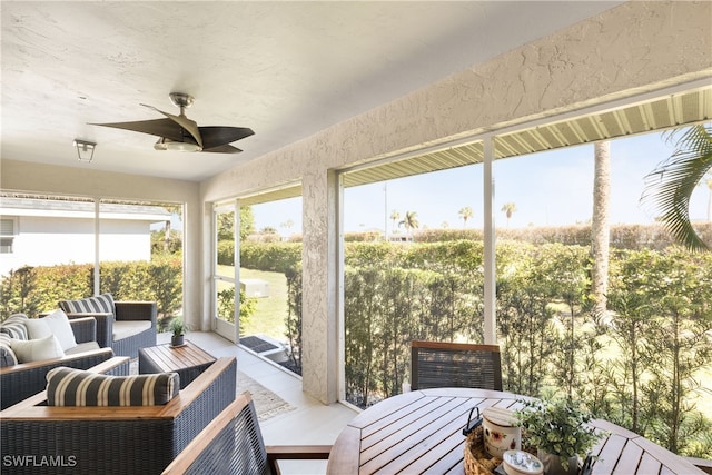 sunroom / solarium with ceiling fan