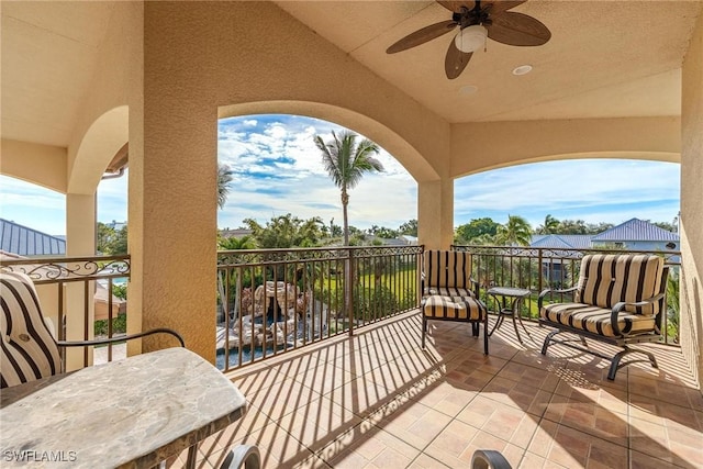 view of patio / terrace featuring a balcony and ceiling fan