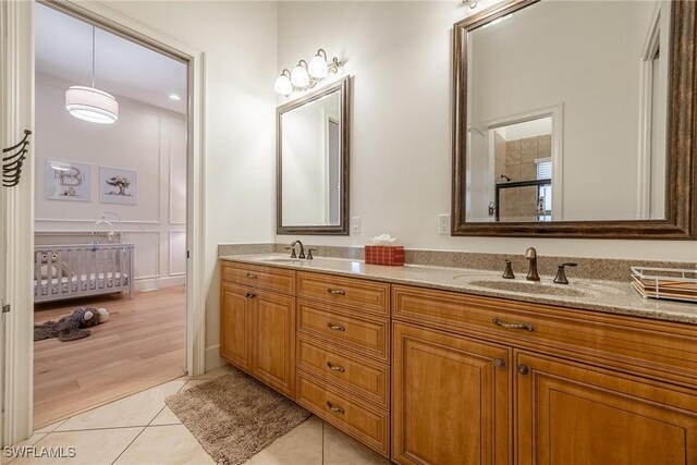 12611 Apopka Ct, North Fort Myers, FL 33903 - full bathroom with double vanity and tile patterned floors