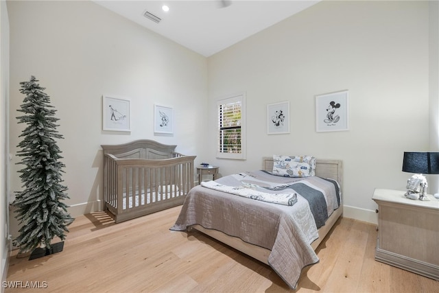 bedroom with light hardwood / wood-style floors