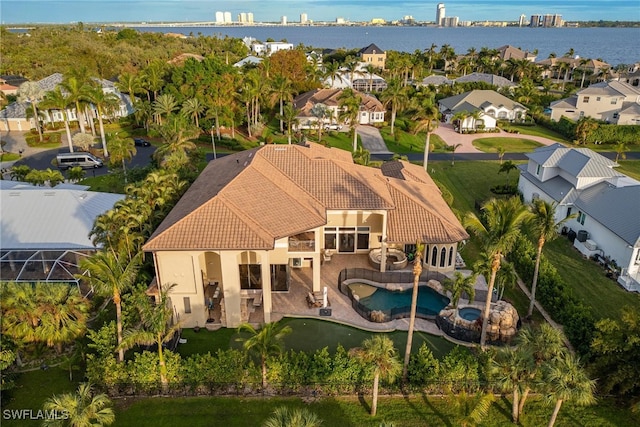 birds eye view of property with a water view