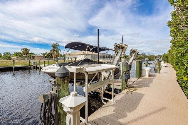 12611 Apopka Ct, North Fort Myers, FL 33903 - dock featuring boat lift and a water view