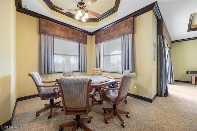 interior space featuring ceiling fan, ornamental molding, and a tray ceiling