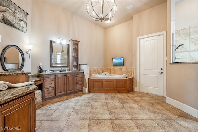 bathroom with shower with separate bathtub, vanity, and a notable chandelier