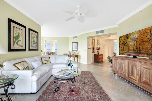 tiled living room featuring ceiling fan and ornamental molding