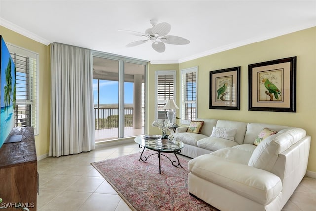 living room with ceiling fan, light tile patterned floors, and ornamental molding