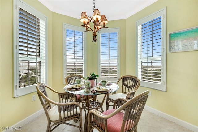 dining space featuring light tile patterned flooring, crown molding, and an inviting chandelier