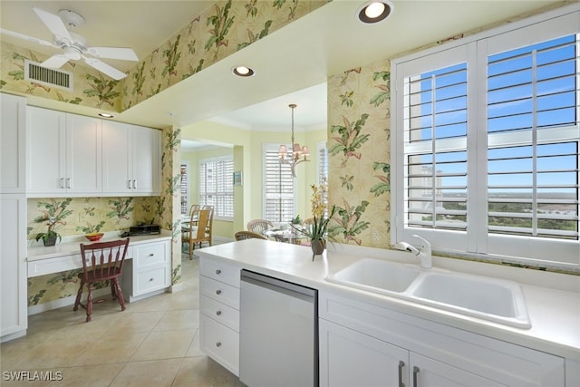 kitchen featuring white cabinets, dishwasher, ornamental molding, and sink