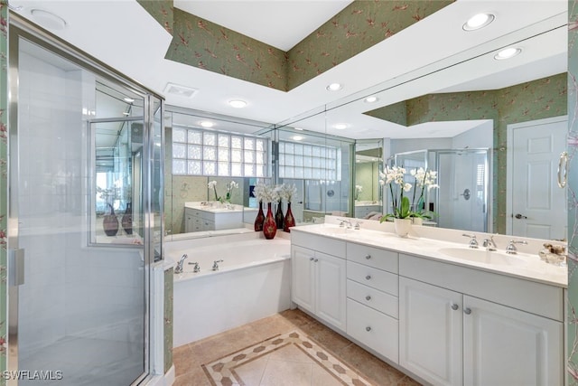 bathroom featuring vanity and shower with separate bathtub