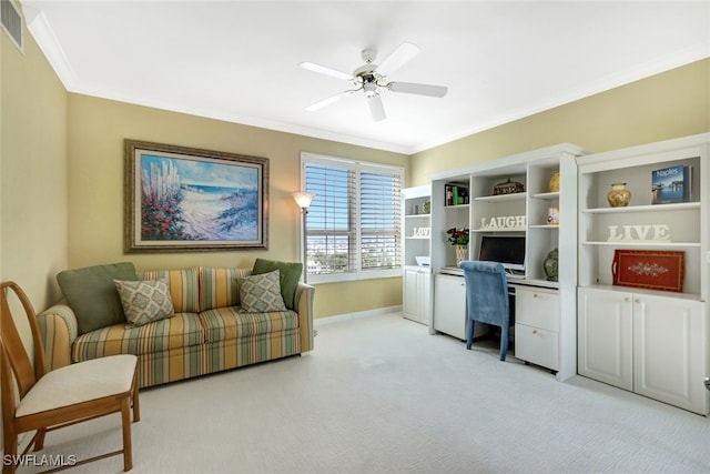 carpeted office with ceiling fan and ornamental molding