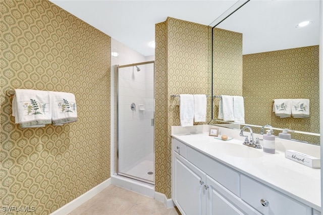 bathroom featuring vanity, tile patterned floors, and a shower with shower door