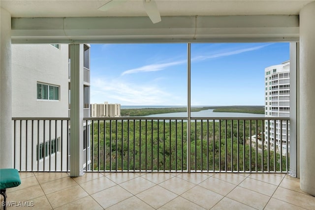 unfurnished sunroom with a water view