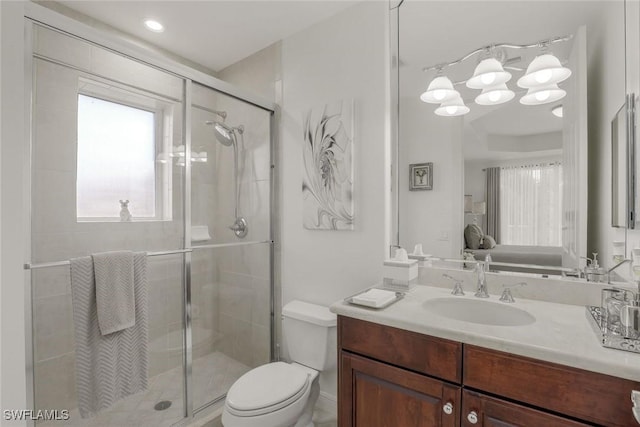 580 El Camino Real Unit 3201, Naples, FL 34119 - bathroom featuring vanity, a stall shower, and connected bathroom