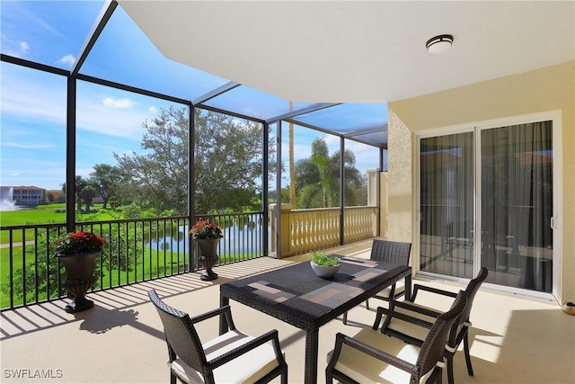 580 El Camino Real Unit 3201, Naples, FL 34119 - sunroom / solarium featuring a water view