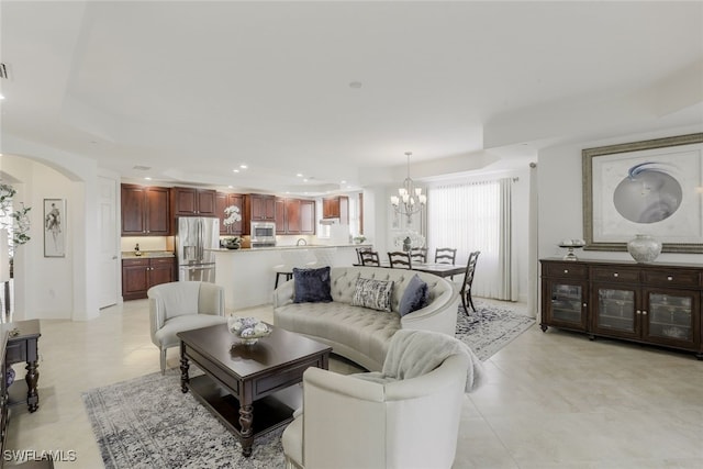 living room with an inviting chandelier