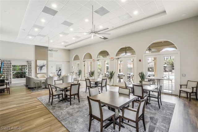 580 El Camino Real Unit 3201, Naples, FL 34119 - dining area featuring a ceiling fan, wood finished floors, a towering ceiling, plenty of natural light, and recessed lighting