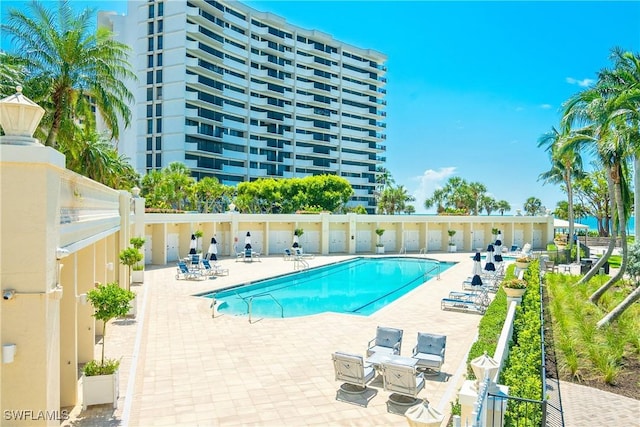 4021 Gulf Shore Blvd N Unit 903, Naples, FL 34103 - community pool featuring a patio area