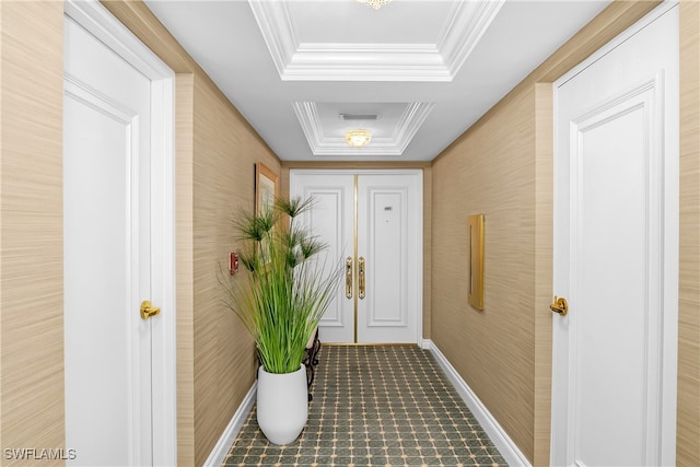 hallway with a raised ceiling