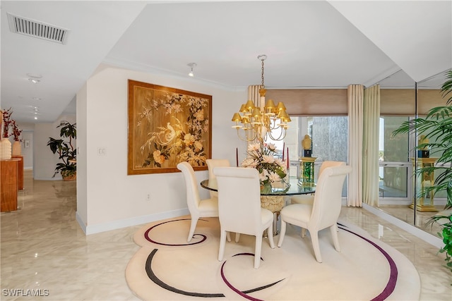 dining space featuring a chandelier and ornamental molding