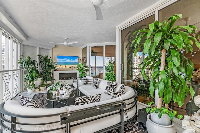 sunroom / solarium with ceiling fan