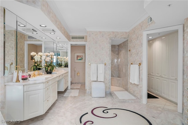 bathroom featuring vanity, toilet, and ornamental molding