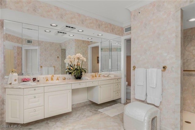 4021 Gulf Shore Blvd N Unit 903, Naples, FL 34103 - full bathroom with double vanity, toilet, crown molding, tiled shower, and recessed lighting