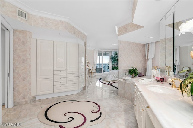 bathroom featuring vanity and ornamental molding