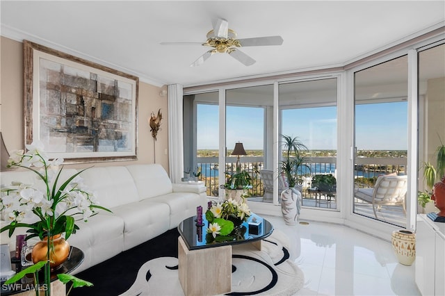 living room with tile patterned flooring, a water view, and ceiling fan