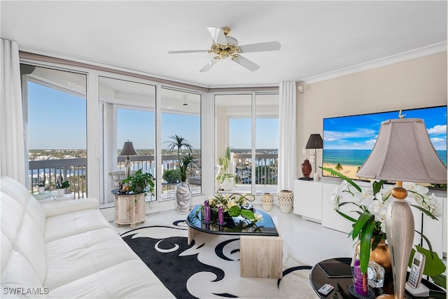 living room with ceiling fan, crown molding, and a wealth of natural light