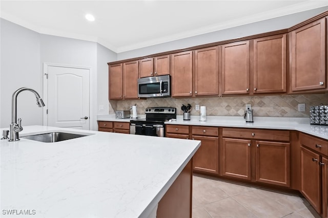 kitchen with sink, stainless steel appliances, crown molding, decorative backsplash, and light tile patterned floors