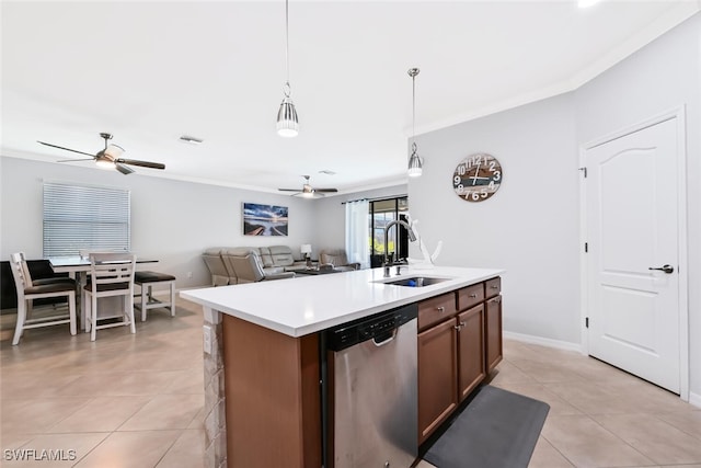 kitchen featuring a kitchen island with sink, hanging light fixtures, sink, stainless steel dishwasher, and light tile patterned flooring