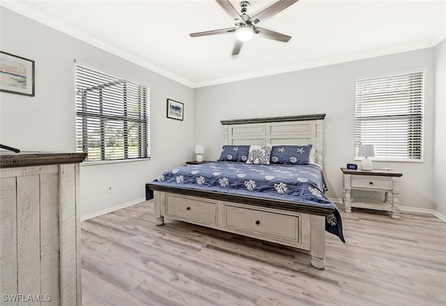 bedroom with ceiling fan, crown molding, and light hardwood / wood-style flooring