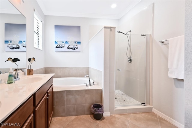 bathroom with tile patterned floors, vanity, plus walk in shower, and ornamental molding