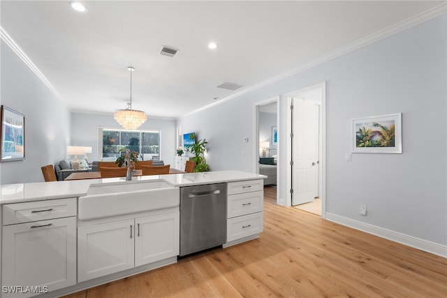 kitchen featuring stainless steel dishwasher, light wood-type flooring, ornamental molding, a notable chandelier, and white cabinetry