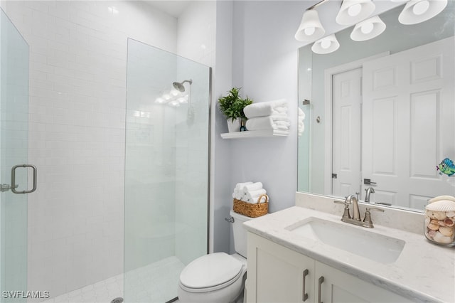 bathroom featuring vanity, toilet, and walk in shower