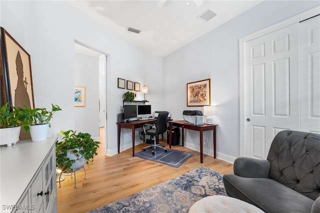 office space with light hardwood / wood-style floors