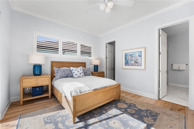 bedroom featuring wood-type flooring, ensuite bathroom, ceiling fan, and ornamental molding