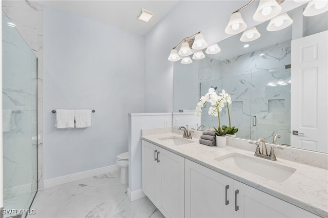 bathroom featuring vanity, toilet, and walk in shower