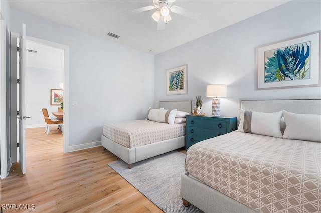 bedroom featuring ceiling fan and light hardwood / wood-style flooring