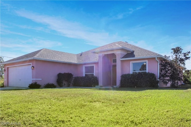 view of front facade featuring a garage and a front yard