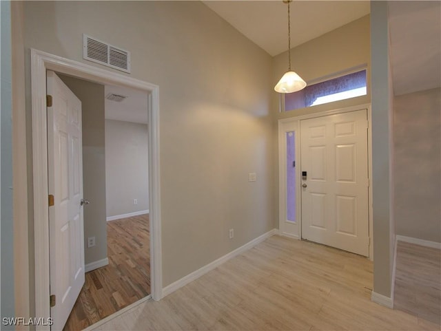 foyer with light hardwood / wood-style flooring