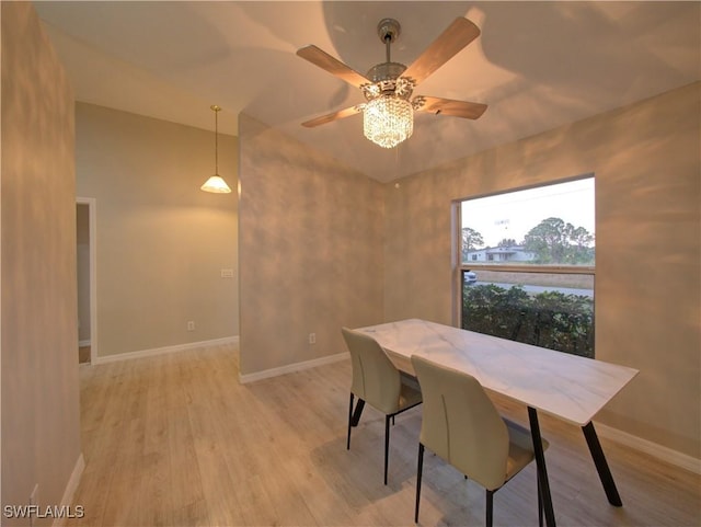 dining space featuring ceiling fan and light hardwood / wood-style floors