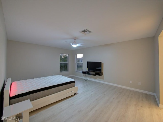 bedroom featuring ceiling fan and light hardwood / wood-style flooring