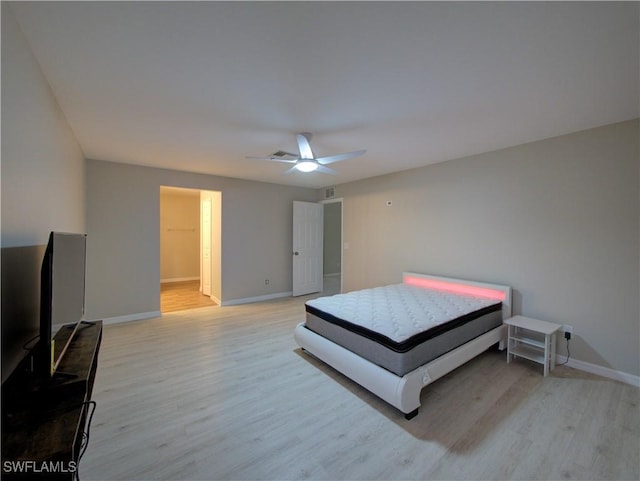 bedroom featuring light hardwood / wood-style flooring and ceiling fan