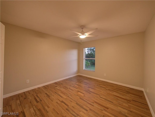 empty room featuring ceiling fan and light wood-type flooring