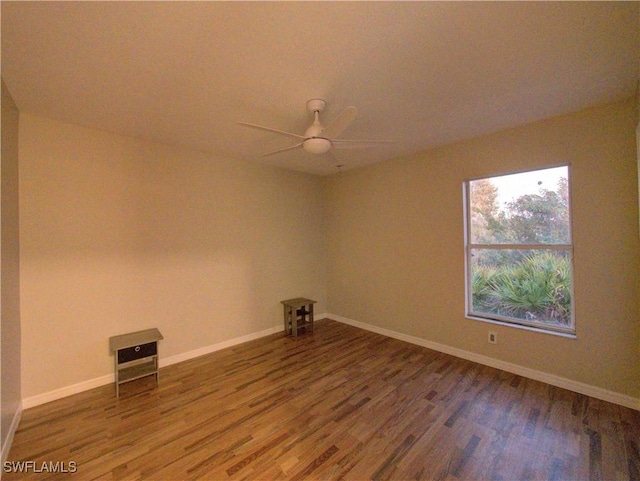 unfurnished room with hardwood / wood-style floors and ceiling fan